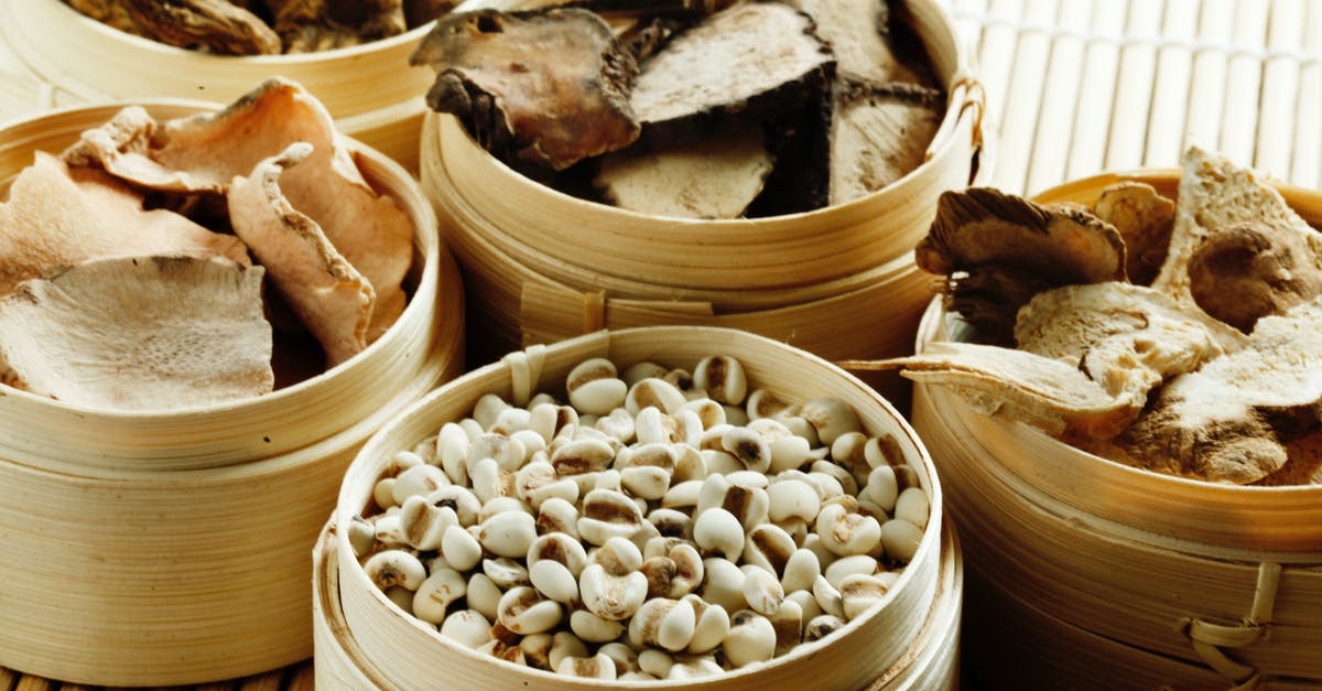 Substituting Dried Shiitake Mushrooms for Fresh - From above many wooden containers filled with assorted dried mushrooms with condiments and raw cashew nuts placed on bamboo mat Substituting Dried Shiitake Mushrooms for Fresh - From above many wooden containers filled with assorted dried mushrooms with condiments and raw cashew nuts placed on bamboo mat