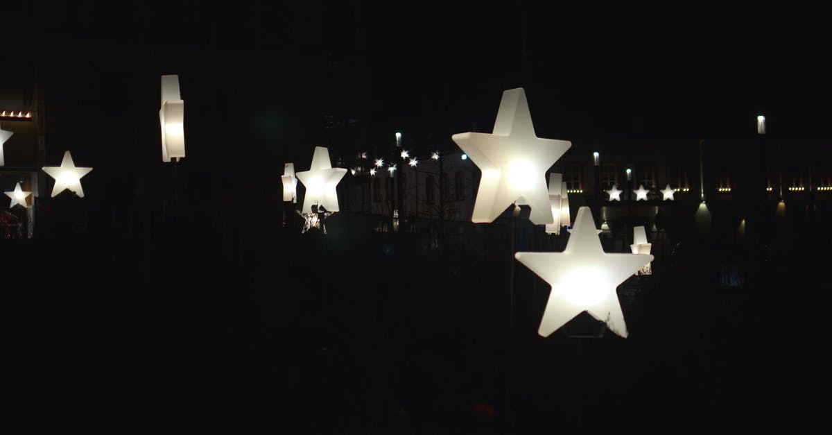Substitution for idealmjöl - Decorative star shaped garlands hanging on street at night Substitution for idealmjöl - Decorative star shaped garlands hanging on street at night