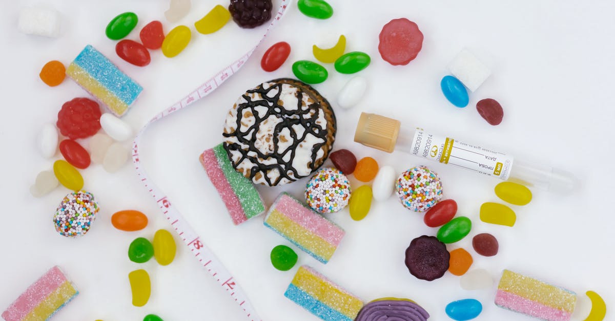 Sugar coated pecans without turning amber - A Tape Measure on a Table Surrounded with Assorted Chewy Candies and Cookies 