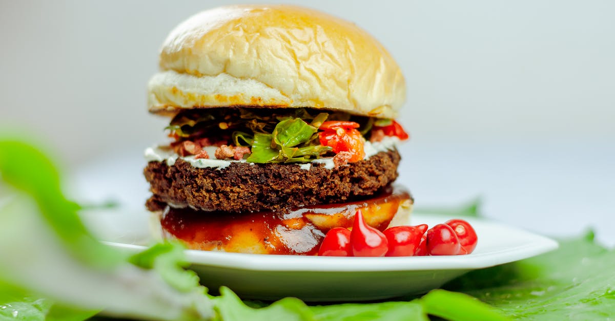 Suggested edible quantity/scaling of Habanero Pepper per pound of meat - Delicious hamburger by vegetables on plate Suggested edible quantity/scaling of Habanero Pepper per pound of meat - Delicious hamburger by vegetables on plate