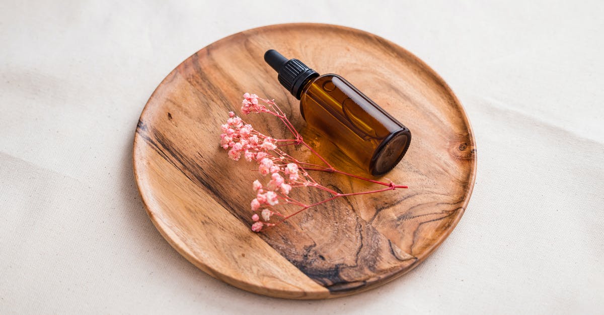 Suitable oil for woking? - Brown Glass Bottle on Brown Wooden Round Table