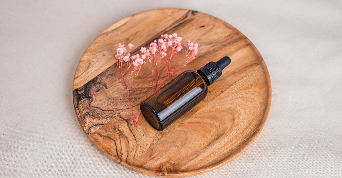 Suitable oil for woking? - Black and Silver Bottle on Brown Wooden Round Table