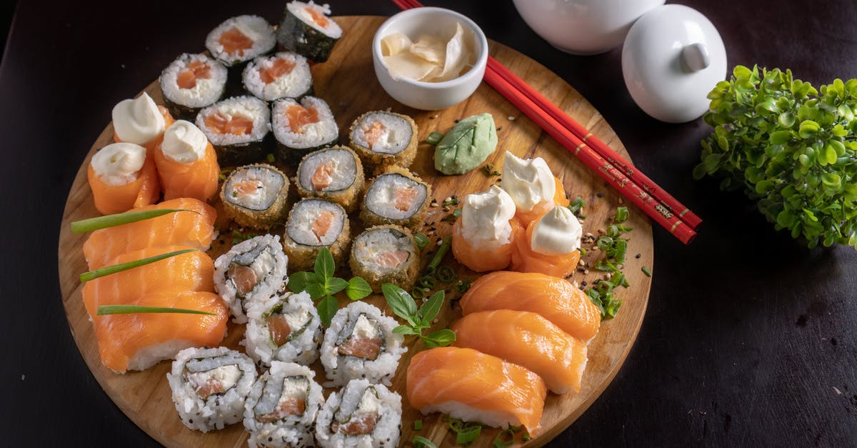 Sushi / sashimi knives - Japanese Sushi and Sashimi on Wooden Tray Sushi / sashimi knives - Japanese Sushi and Sashimi on Wooden Tray