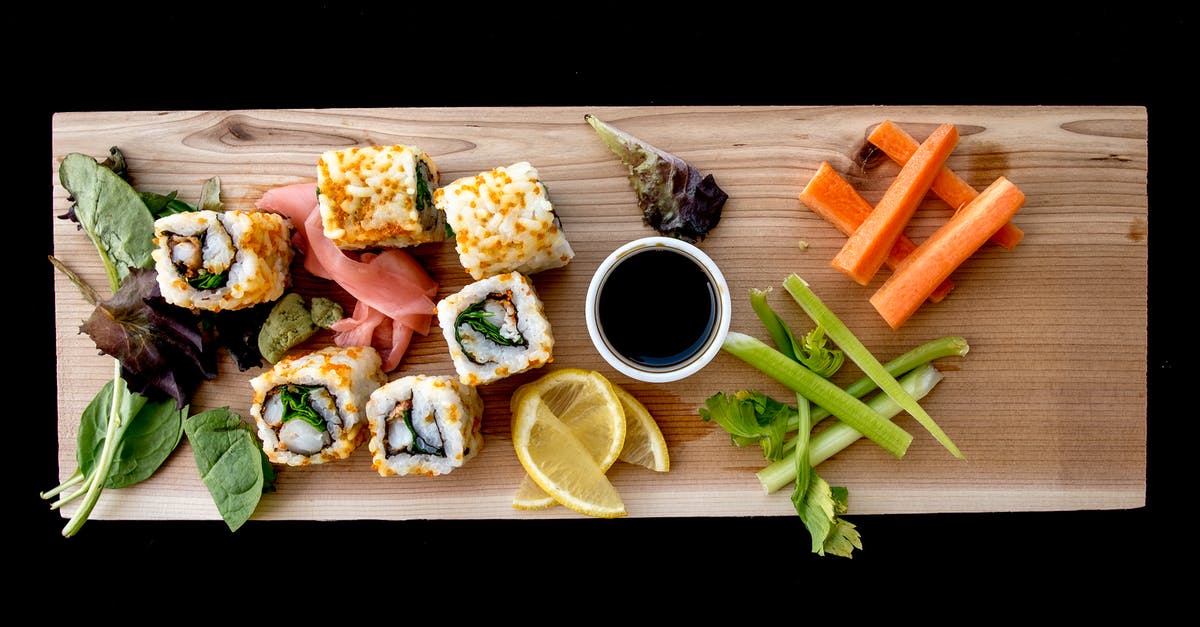 Sushi rolls keep getting thin - Cooked Food on Brown Wooden Board Sushi rolls keep getting thin - Cooked Food on Brown Wooden Board