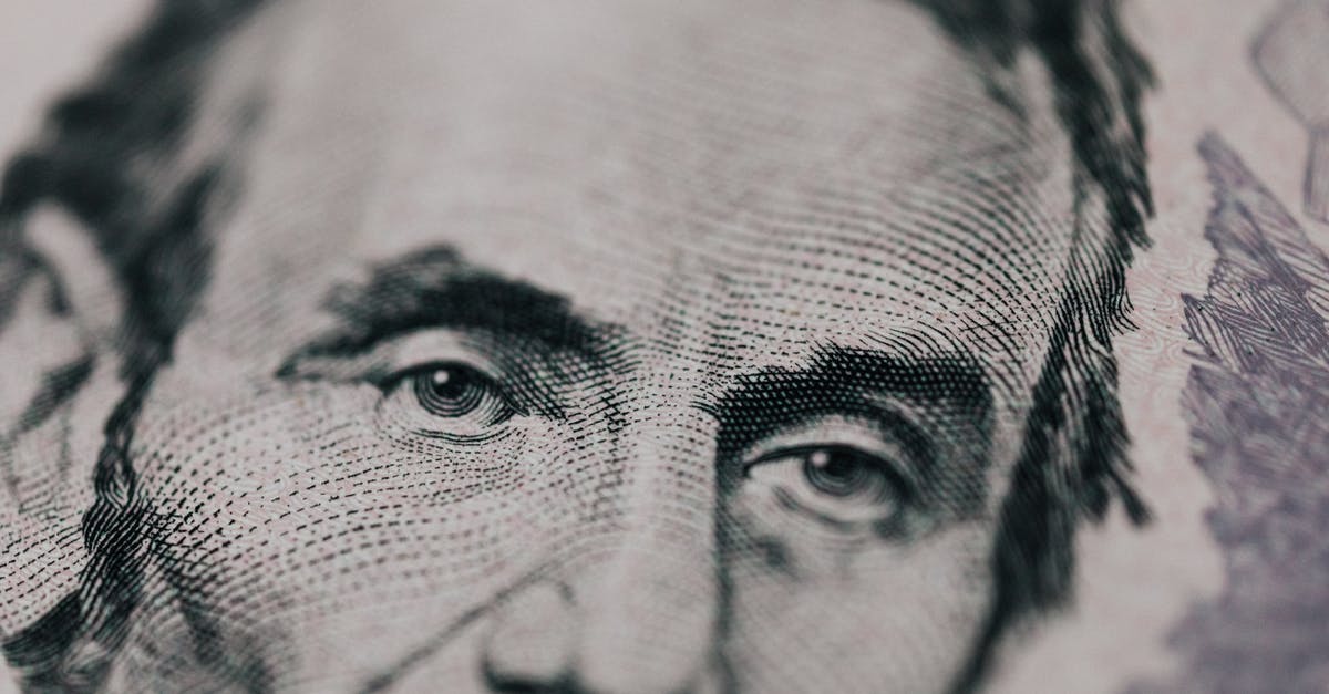 tarry deposit in wok - Closeup of male American president printed on five dollar bill and looking away pensively tarry deposit in wok - Closeup of male American president printed on five dollar bill and looking away pensively