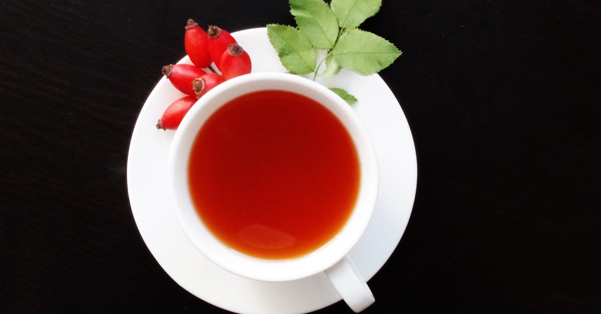 Tea leaf grades and plucking standards - White Cup Filled With Orange Liquid on Top of White Saucer Tea leaf grades and plucking standards - White Cup Filled With Orange Liquid on Top of White Saucer