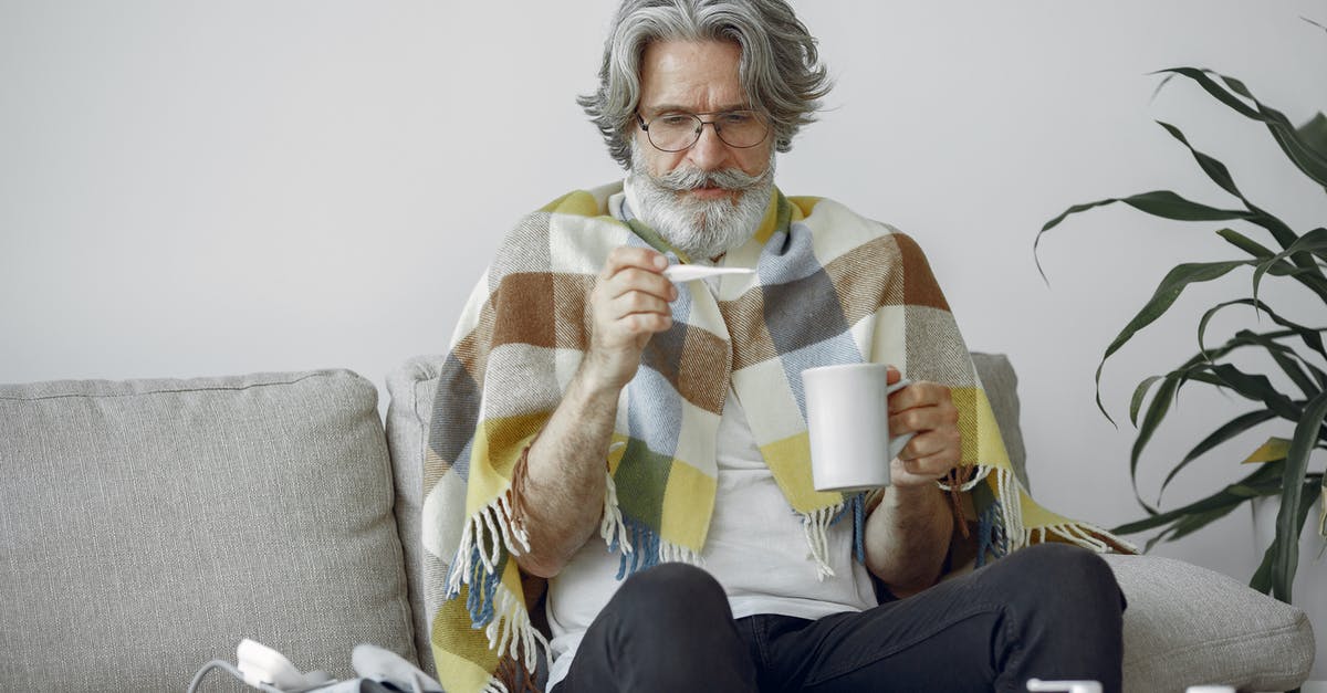 Tea temperature for preparation - Woman in White and Brown Sweater Holding White Ceramic Mug Tea temperature for preparation - Woman in White and Brown Sweater Holding White Ceramic Mug
