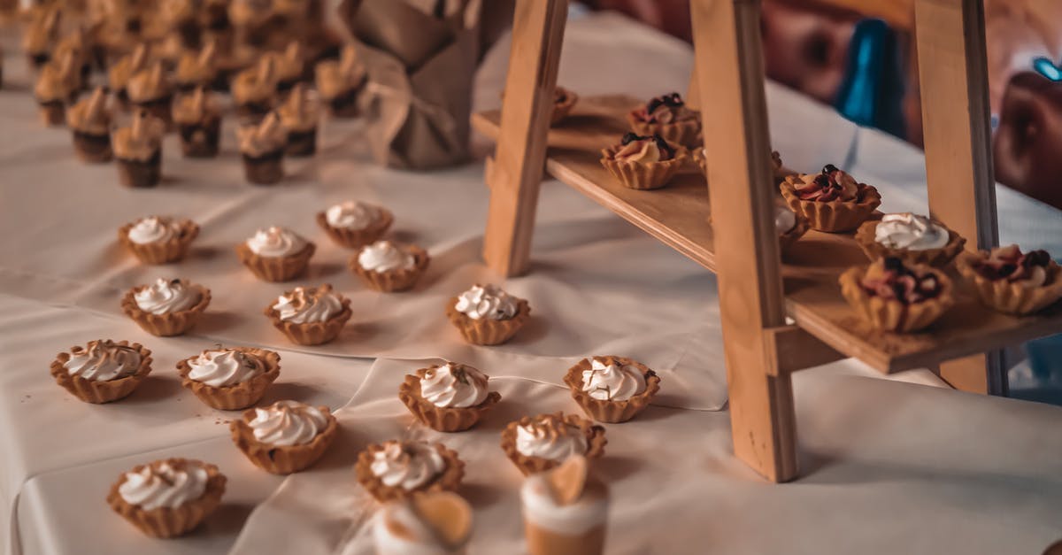 Technical reasons against chocolate-coated shortbread - From above assortment of shortbread tarts with cream on table with desserts for festive special event Technical reasons against chocolate-coated shortbread - From above assortment of shortbread tarts with cream on table with desserts for festive special event