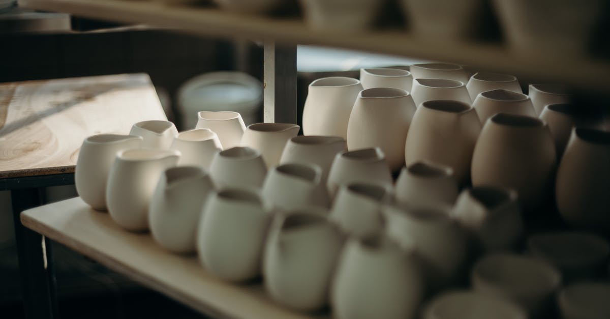 Teflon vs. Porcelain lined cookware (stove top) - Photo Of Pots On Shelves Teflon vs. Porcelain lined cookware (stove top) - Photo Of Pots On Shelves