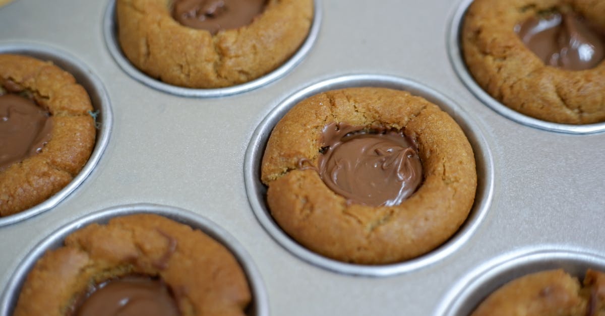 Tempering chocolate without a thermometer - Brown Cookies on White Surface Tempering chocolate without a thermometer - Brown Cookies on White Surface