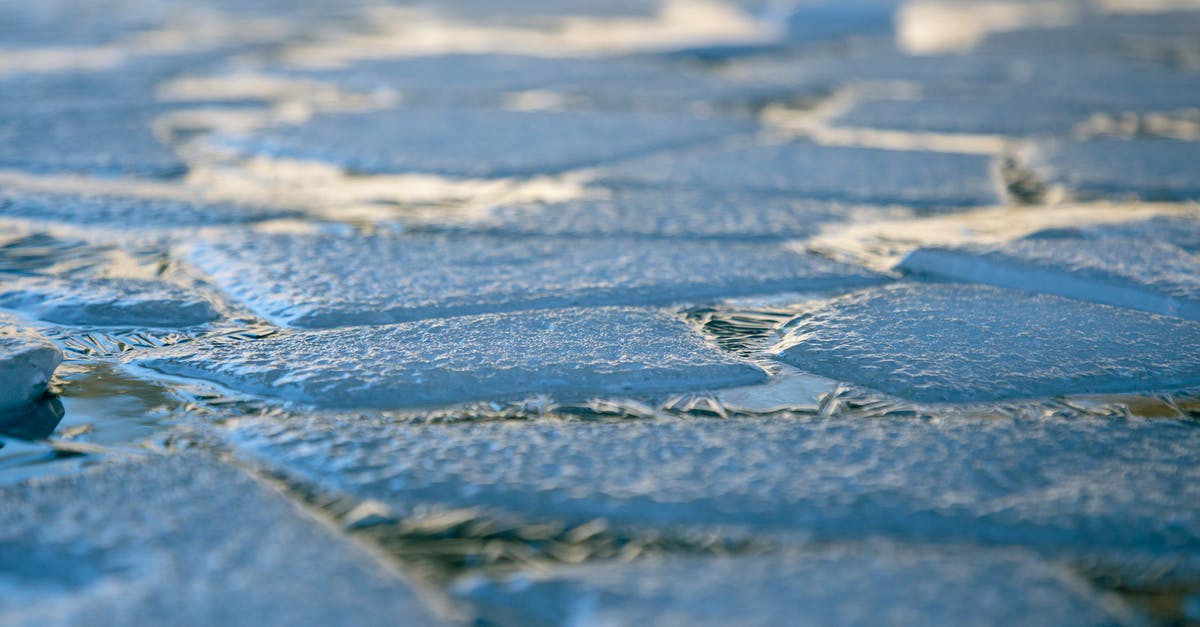 Thawing frozen turkey slices - Pieces of Ice in Water Thawing frozen turkey slices - Pieces of Ice in Water