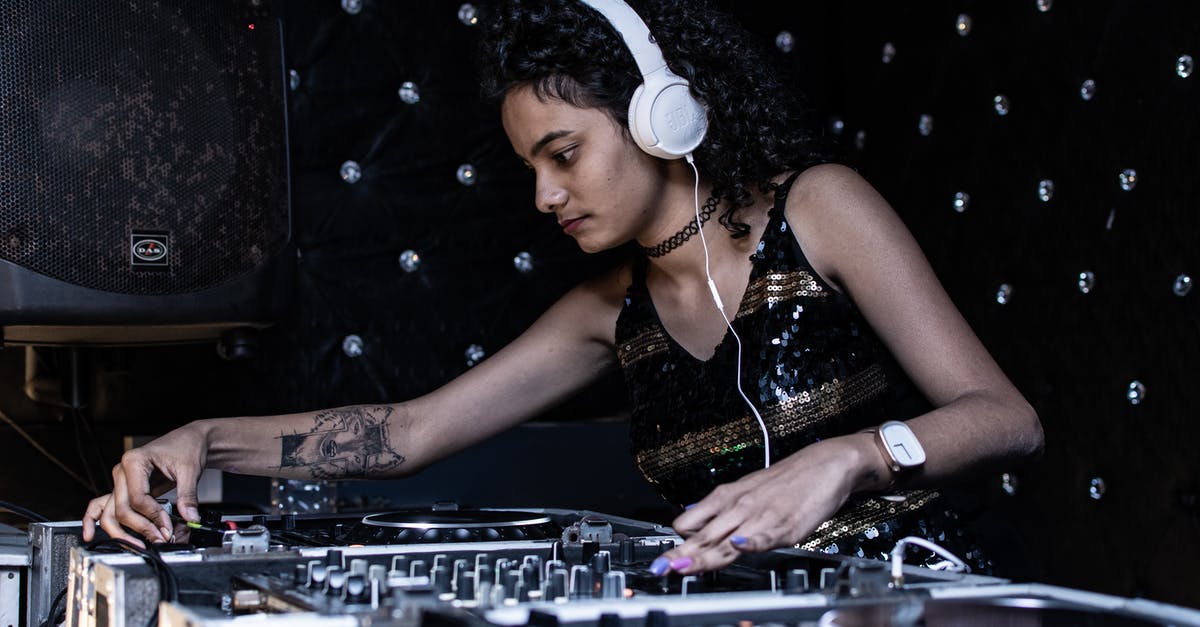The art of Sushi: using wasabi to kill parasites - Focused ethnic female DJ playing music at nightclub The art of Sushi: using wasabi to kill parasites - Focused ethnic female DJ playing music at nightclub