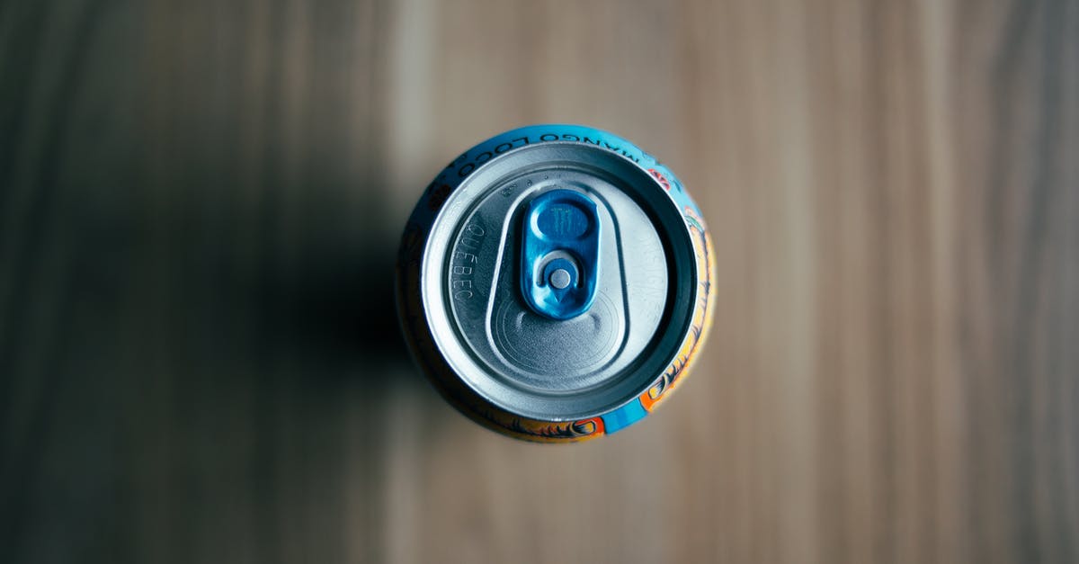 The mystery of heating up canned beans- What the tin says - A Can of Drink over a Wooden Table The mystery of heating up canned beans- What the tin says - A Can of Drink over a Wooden Table