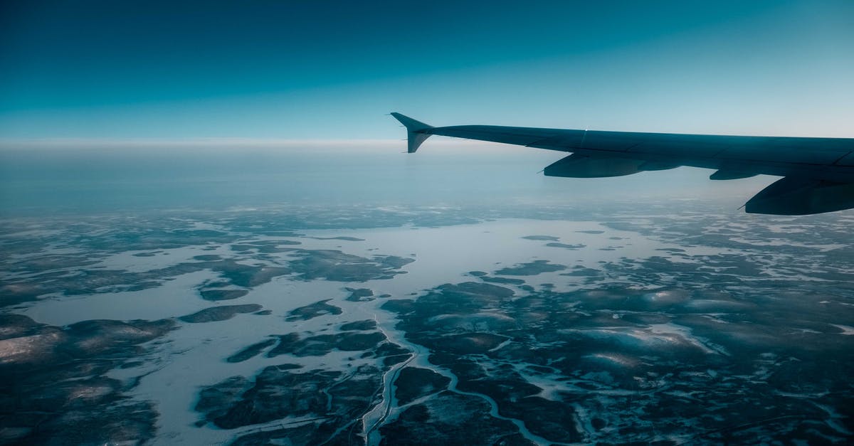 Thermometers for high temperature ovens - Airplane wing over snowy terrain Thermometers for high temperature ovens - Airplane wing over snowy terrain