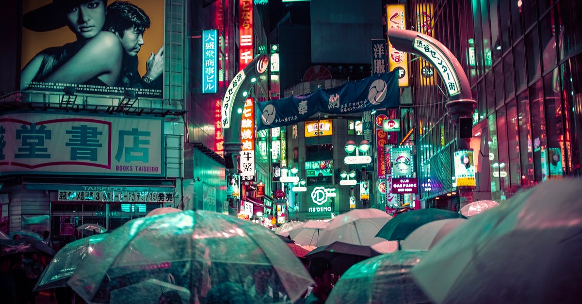 Timing Stock/Broth Perfectly - People Near Buildings during Nighttime With Lights Timing Stock/Broth Perfectly - People Near Buildings during Nighttime With Lights