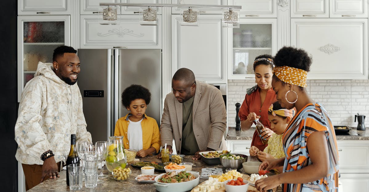 Tips on cooking Christmas dinner for large group - Family Preparing Food in the Kitchen Tips on cooking Christmas dinner for large group - Family Preparing Food in the Kitchen