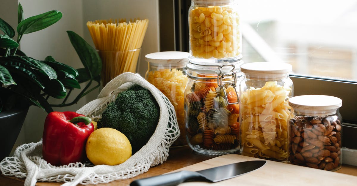 To chop or to blend? - Assorted vegetables placed on counter near jars with pasta To chop or to blend? - Assorted vegetables placed on counter near jars with pasta