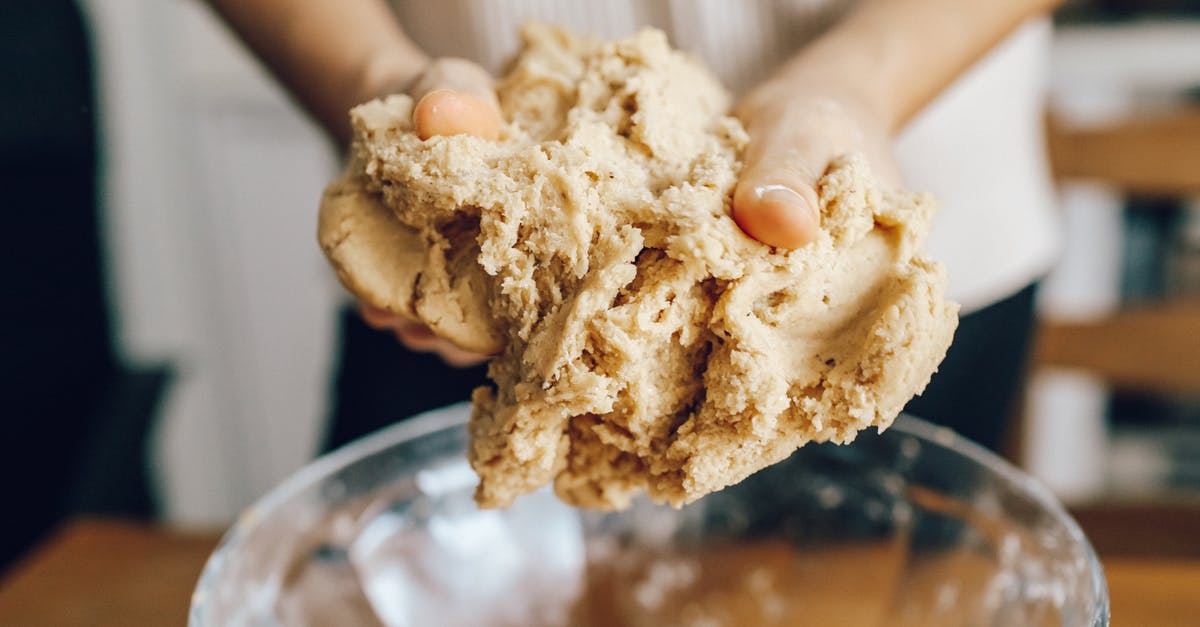 To knead or not to knead, that is the question [closed] - Selective Focus Photo of a Person Kneading a Brown Dough