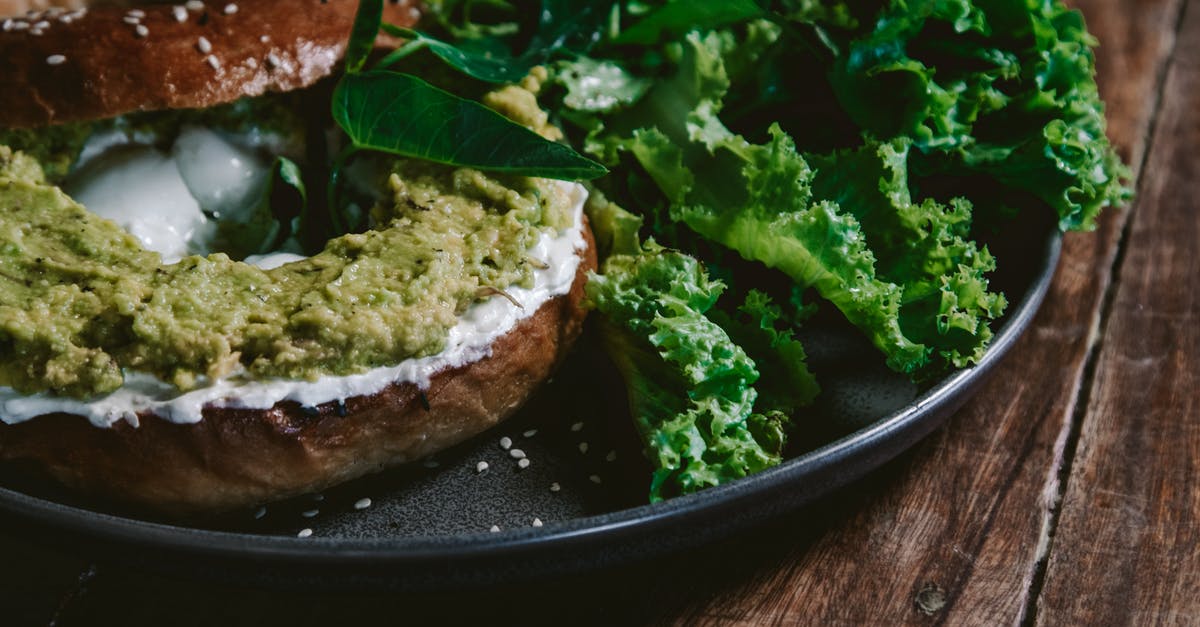 Toasting bagel in my oven - Close-up Photo of Bagel Bread with Avocado Spread Toasting bagel in my oven - Close-up Photo of Bagel Bread with Avocado Spread