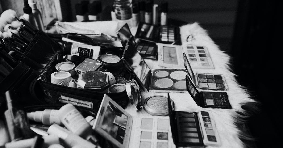 Toning down lamb with mustard powder: universal tool? - Black and white high angle of assorted makeup products and tools placed on dressing table near mirror Toning down lamb with mustard powder: universal tool? - Black and white high angle of assorted makeup products and tools placed on dressing table near mirror
