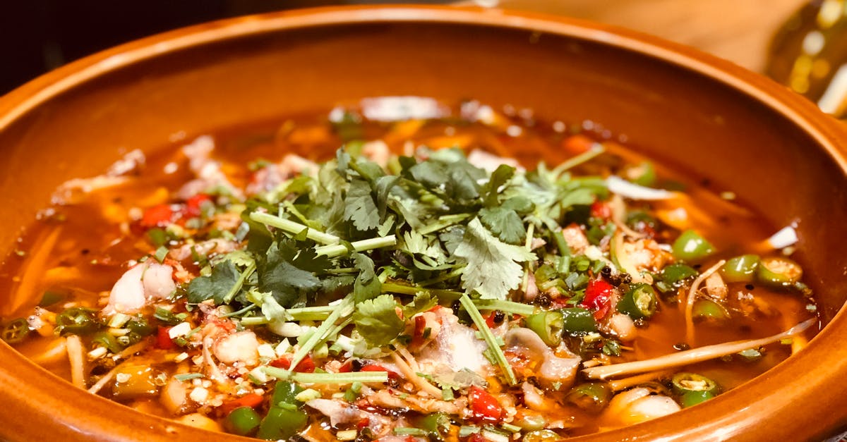 Too much pepper in soup: any way to fix? - Green Basil Topped Dish in Brown Bowl Too much pepper in soup: any way to fix? - Green Basil Topped Dish in Brown Bowl
