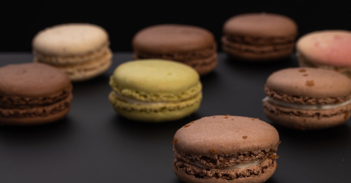 Too Soft Cookie Dough - Small round macaroons on black surface Too Soft Cookie Dough - Small round macaroons on black surface