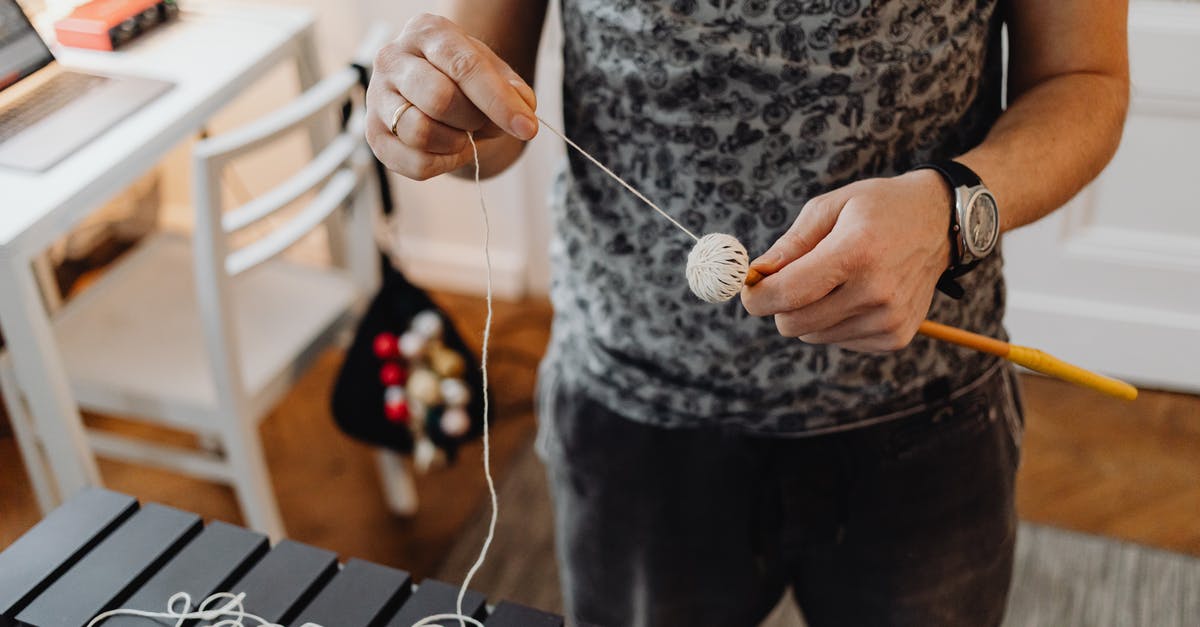Tools for making Pasta - A Person Holding a Stick and Yarn Tools for making Pasta - A Person Holding a Stick and Yarn