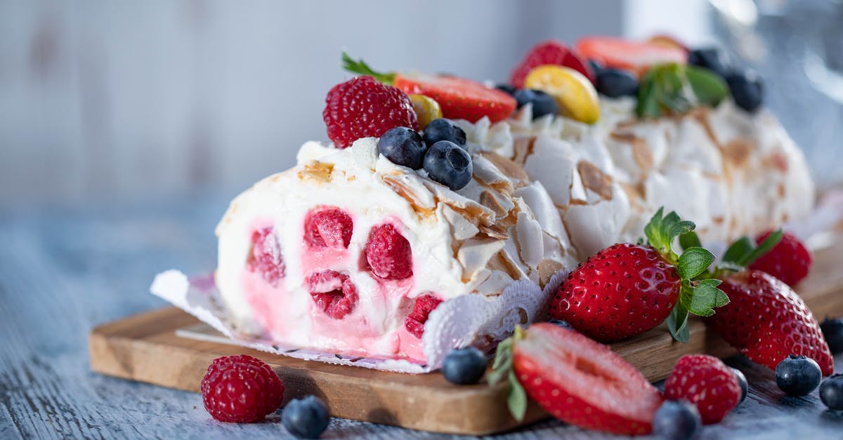 Tootsie Roll Flavor - Sweet meringue roll with cream and berries Tootsie Roll Flavor - Sweet meringue roll with cream and berries