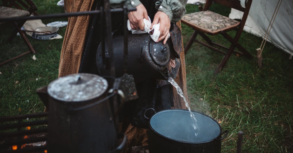 Tramontina lid stuck to pot - Person Pouring Water on Cooking Pot Tramontina lid stuck to pot - Person Pouring Water on Cooking Pot