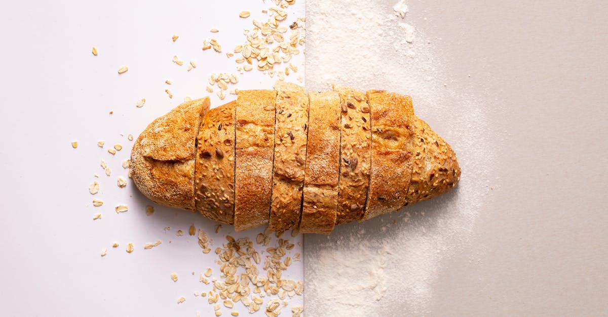 Trapped pockted of flour in dough - Sliced Bread On Gray Surface Trapped pockted of flour in dough - Sliced Bread On Gray Surface
