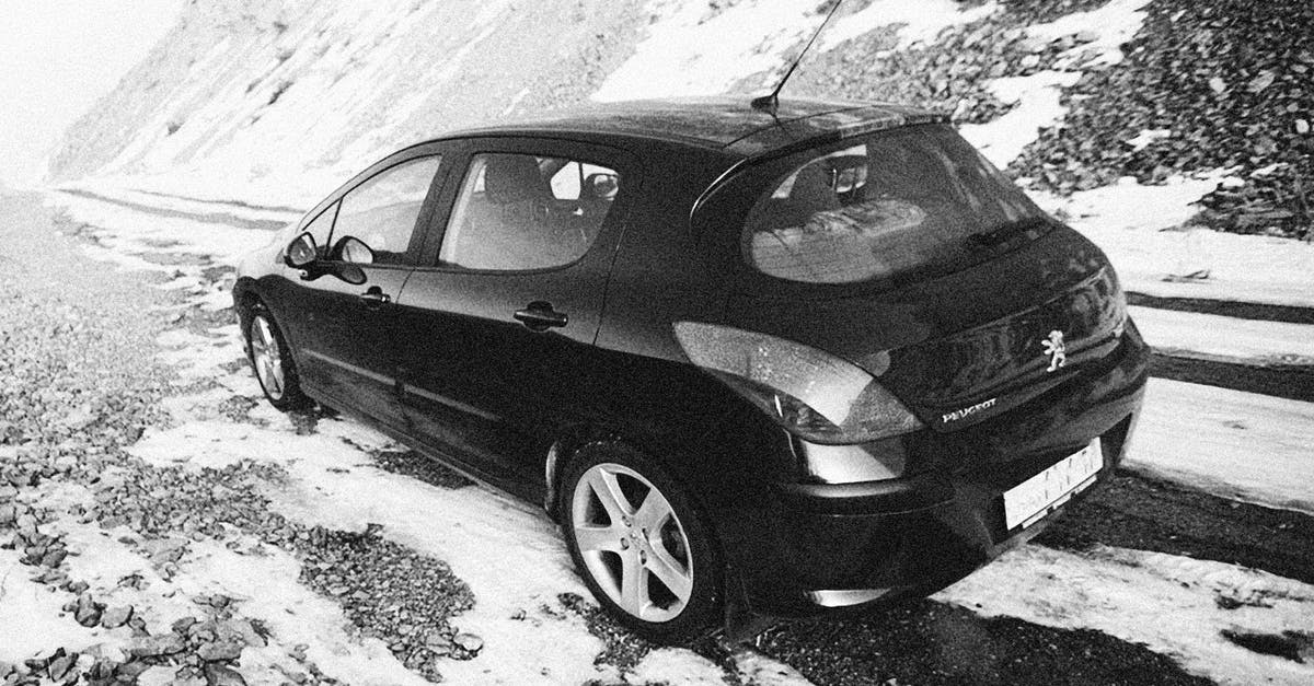 Trimming ends off snow peas - A Car Parked on the Snow Covered Mountain Road Trimming ends off snow peas - A Car Parked on the Snow Covered Mountain Road