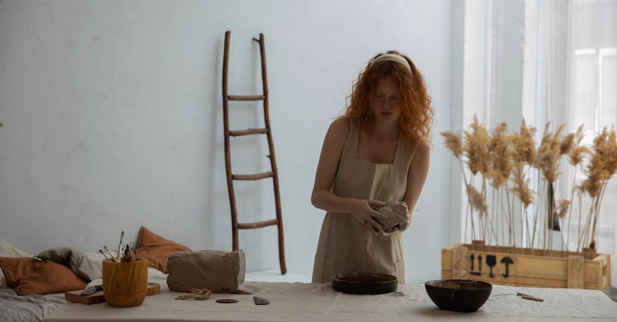Trusted Custom mold manufacturers for confections - Redhead woman working with clay Trusted Custom mold manufacturers for confections - Redhead woman working with clay