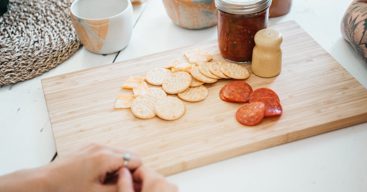 Trying to recreate my grandmother's buttermilk biscuits - Person Holding Brown Wooden Chopping Board With Brown Cookies Trying to recreate my grandmother's buttermilk biscuits - Person Holding Brown Wooden Chopping Board With Brown Cookies