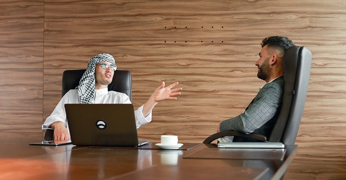 Turkish Coffee necessities - Men Sitting on Office Chairs while Having Conversation Turkish Coffee necessities - Men Sitting on Office Chairs while Having Conversation