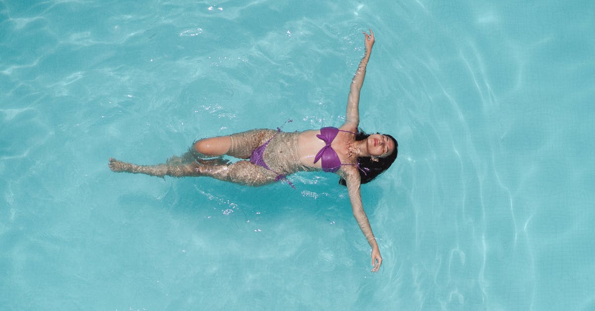 Turkish Delight is too wet - Relaxed young ethnic lady lying on back in swimming pool with closed eyes