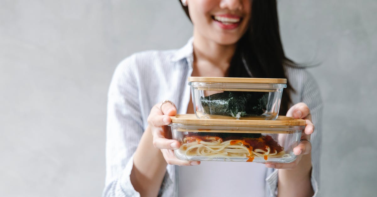 Turkish delight sauce or syrup - Cheerful Asian woman with food in containers Turkish delight sauce or syrup - Cheerful Asian woman with food in containers