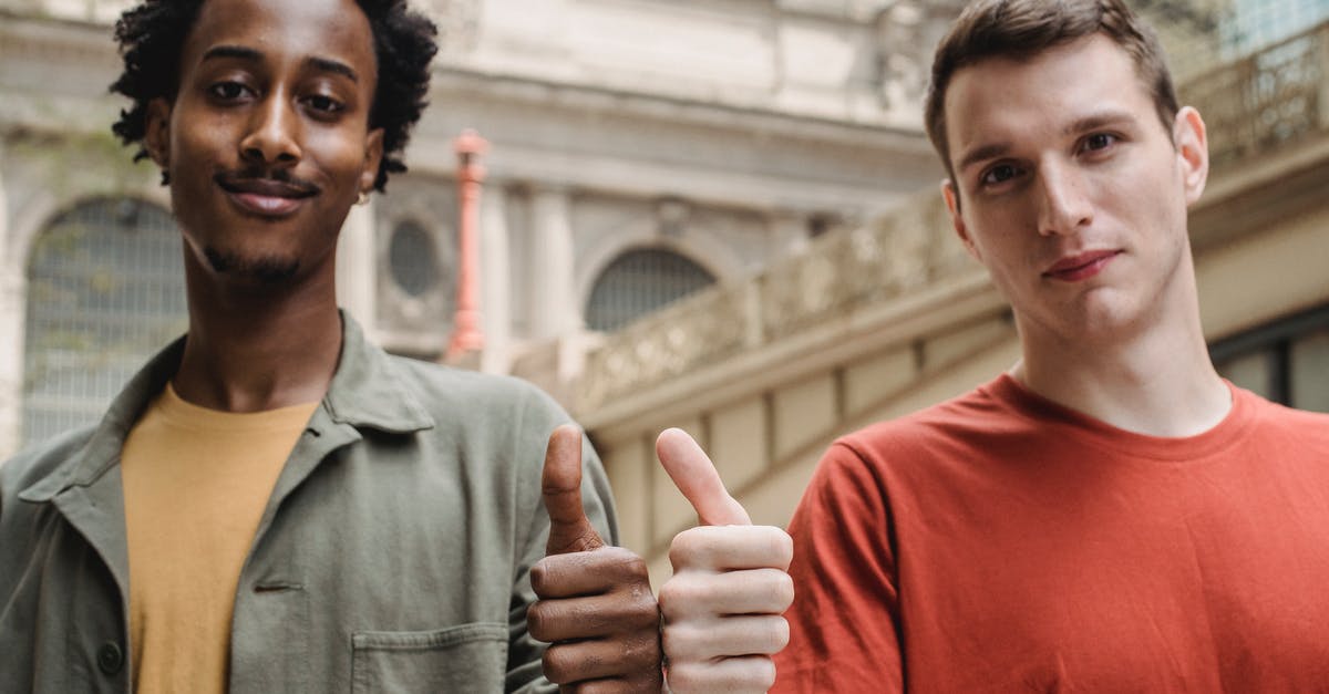 TV Programs like Good Eats - Positive young multiracial guys demonstrating thumbs up sign at camera TV Programs like Good Eats - Positive young multiracial guys demonstrating thumbs up sign at camera