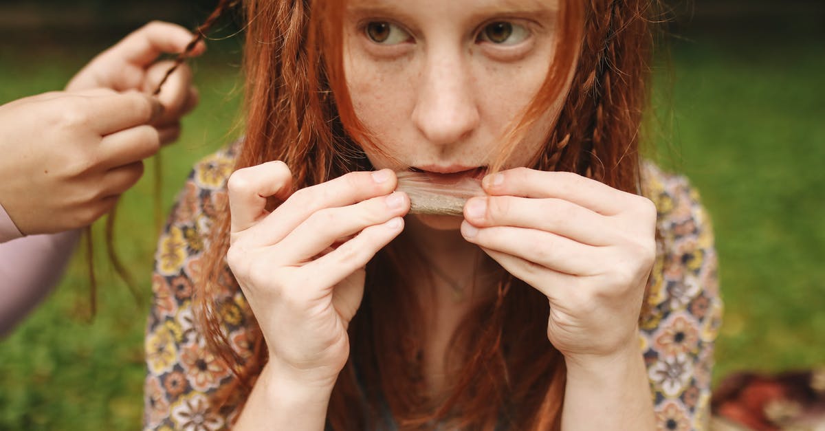 Type of smoker and location [closed] - Woman in Black and Yellow Floral Shirt Covering Her Face With Her Hair