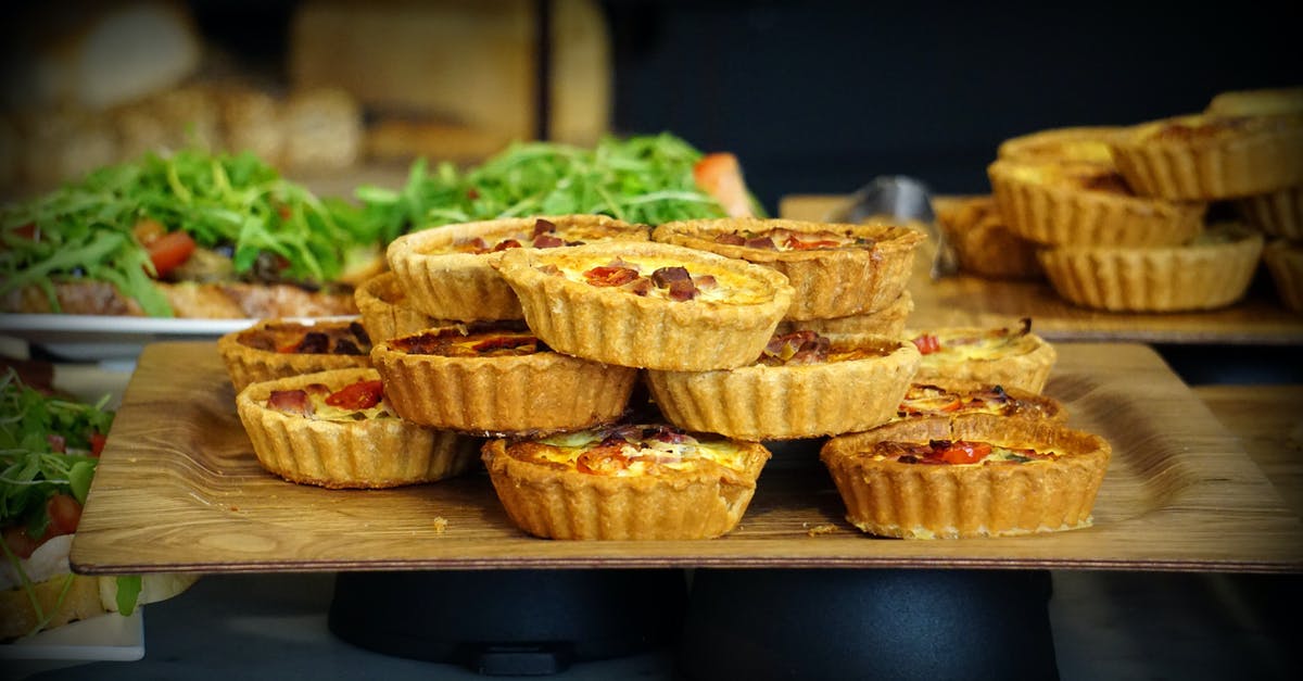 Undercooked Quiche - Dessert Served on Brown Wooden Tray Undercooked Quiche - Dessert Served on Brown Wooden Tray
