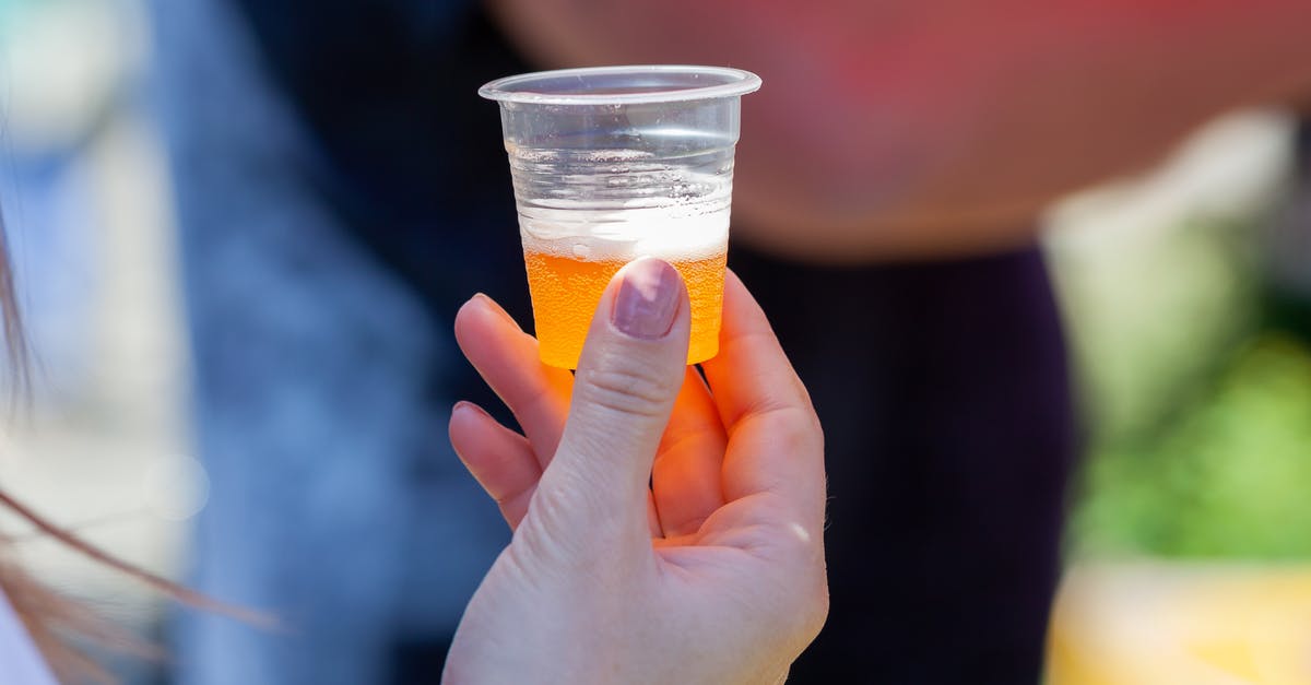 Unsure why foam sauce doesn't hold - A Person Holding a Plastic Cup with Beer