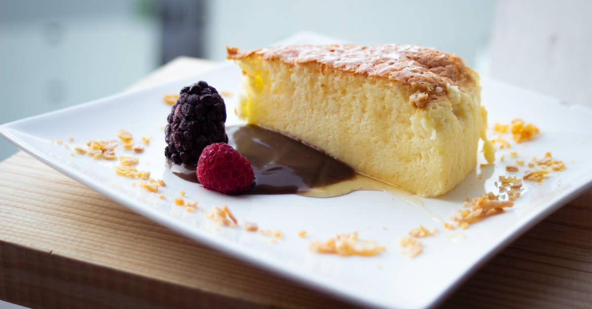 Unwanted rise in Japanese Cheesecake - Close-Up Photo of a Slice of Cheesecake Beside Raspberry Fruits Unwanted rise in Japanese Cheesecake - Close-Up Photo of a Slice of Cheesecake Beside Raspberry Fruits