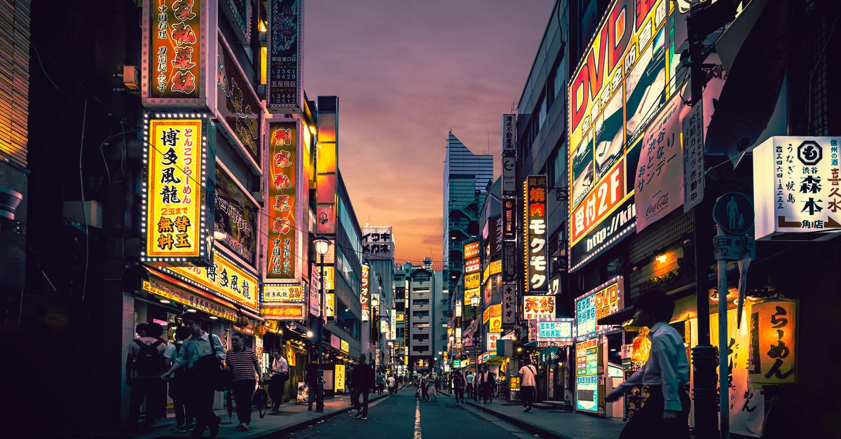 Unwanted rise in Japanese Cheesecake - People Walking on Street Near Buildings Unwanted rise in Japanese Cheesecake - People Walking on Street Near Buildings
