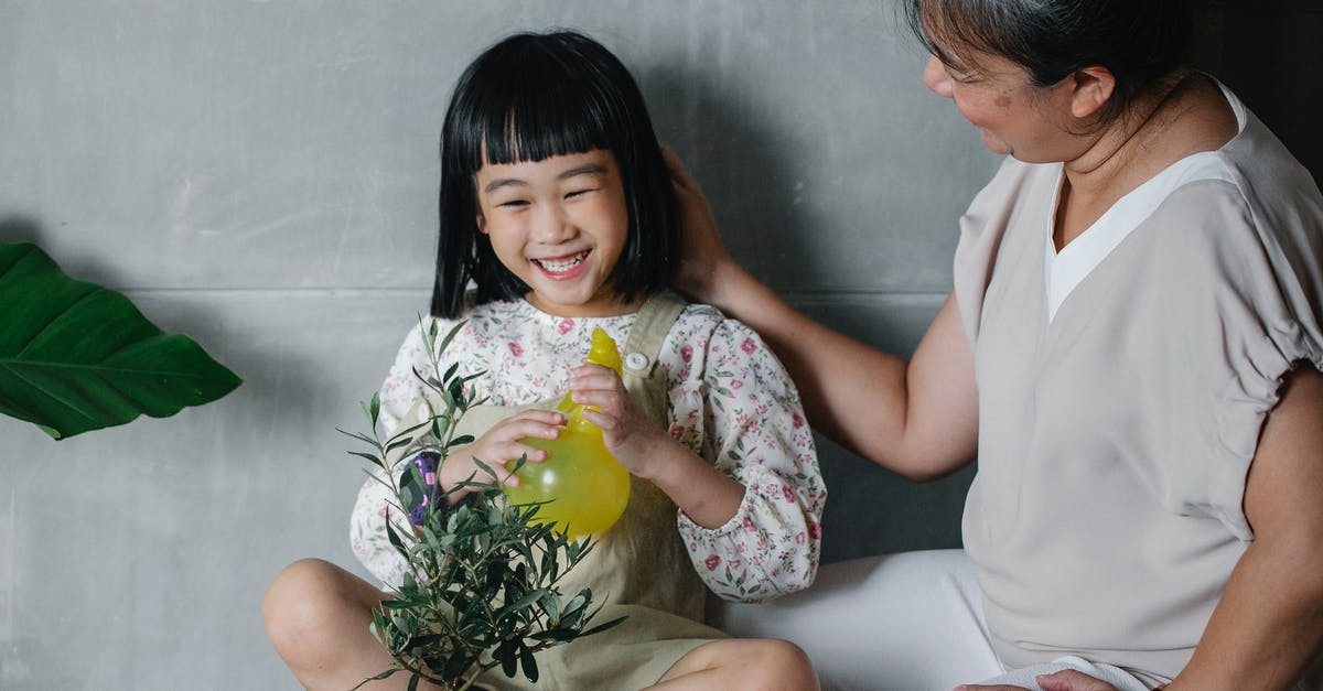 Use chia seeds to help thicken a pot pie - Laughing girl with grandmother taking care of plant Use chia seeds to help thicken a pot pie - Laughing girl with grandmother taking care of plant