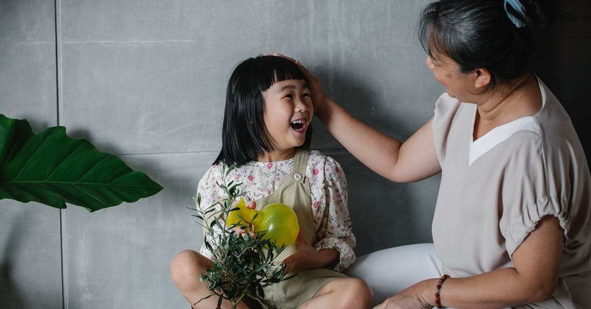 Use chia seeds to help thicken a pot pie - Happy Asian woman caressing charming granddaughter with green plant in pot spending time at home Use chia seeds to help thicken a pot pie - Happy Asian woman caressing charming granddaughter with green plant in pot spending time at home