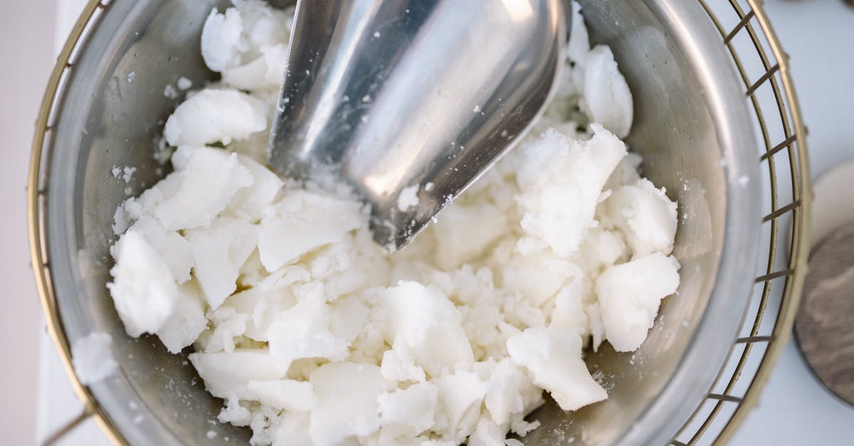 Use flour vs oil in rising dough - Stainless Steel Spoon on White Rice Use flour vs oil in rising dough - Stainless Steel Spoon on White Rice