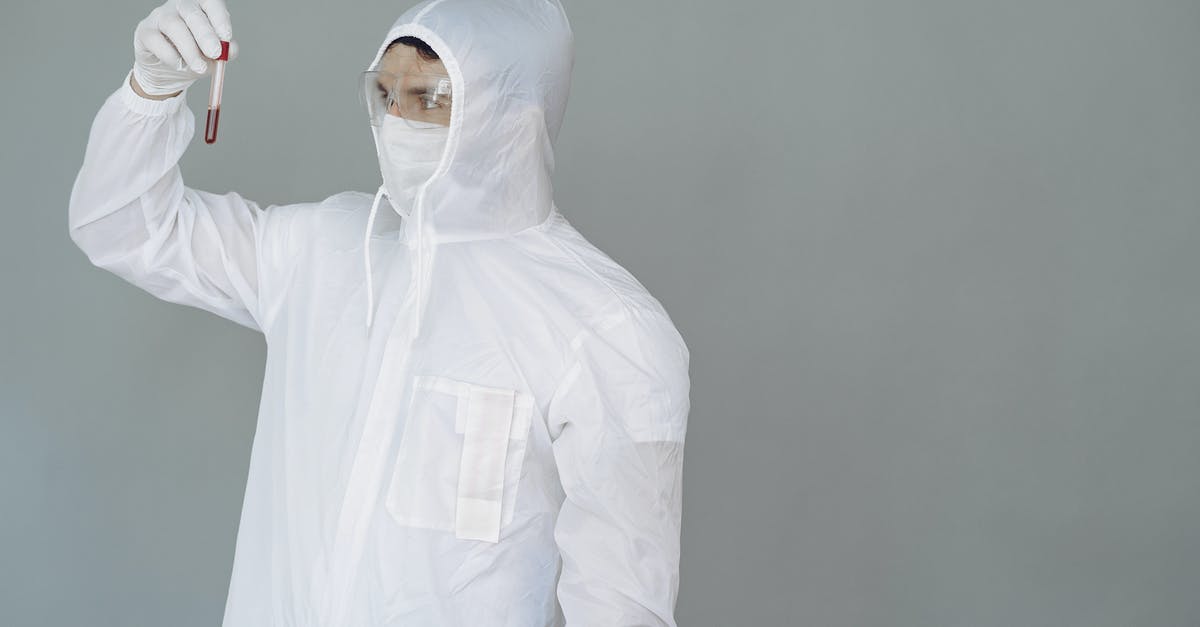 Use of thawed Beef blood - Person in Personal Protective Equipment Holding Test Tube