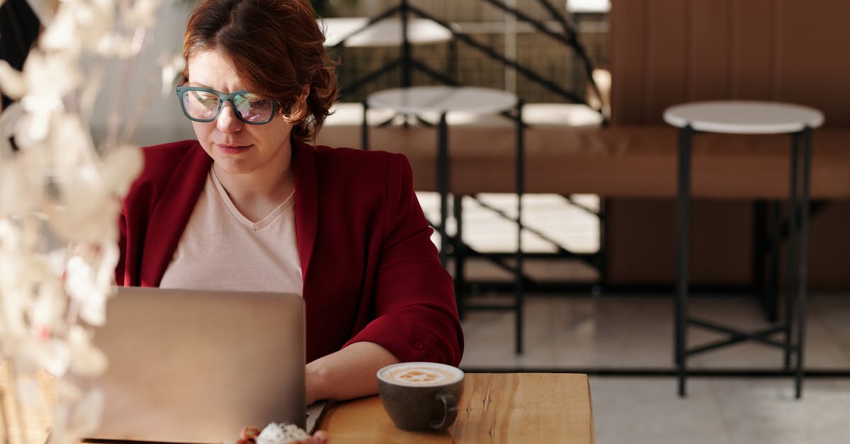 Using a browning dish to microwave meat - Woman in Red Blazer Using Laptop
