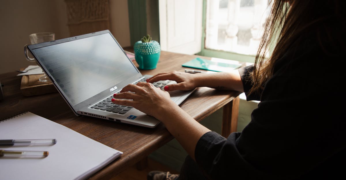 Using a large pot/pan on a smaller burner - Woman in Black Long Sleeve Shirt Using Macbook Pro on Brown Wooden Table Using a large pot/pan on a smaller burner - Woman in Black Long Sleeve Shirt Using Macbook Pro on Brown Wooden Table