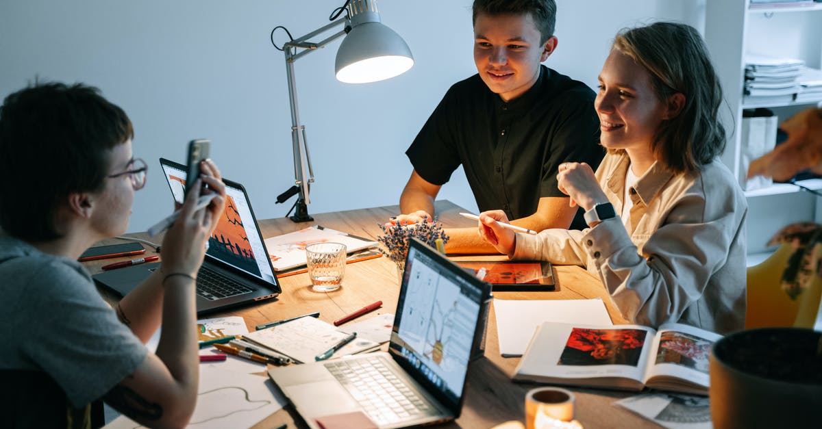 Using a paper towel as a splatter shield: Great idea or terrible accident waiting to happen? - Man and Woman Sitting at Table Using a paper towel as a splatter shield: Great idea or terrible accident waiting to happen? - Man and Woman Sitting at Table