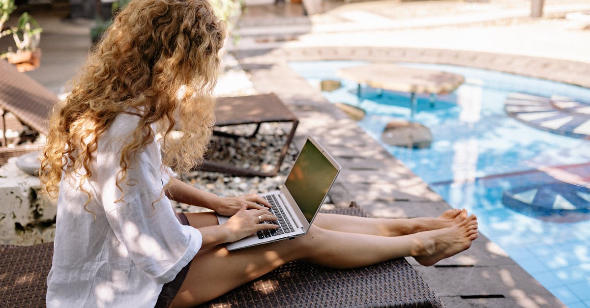 Using acidity to brighten simple sides like purees - From above side view of unrecognizable barefoot female traveler with curly hair typing on netbook while resting on sunbed near swimming pool on sunny day Using acidity to brighten simple sides like purees - From above side view of unrecognizable barefoot female traveler with curly hair typing on netbook while resting on sunbed near swimming pool on sunny day